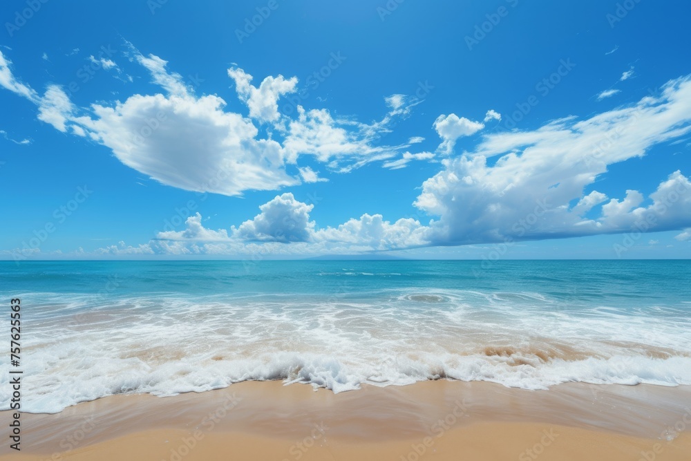 Calm beach, sea and clouds under blue sky.