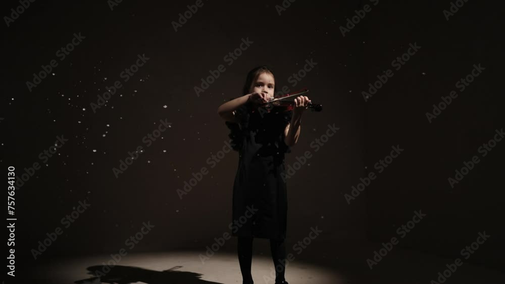 Charming Little Violinist Girl Playing Classic Music In Studio With Snow Flying Up, Slow Motion Charming Little Violinist Girl Playing Classic Music In Studio With Snow Flying Up, Slow Motion