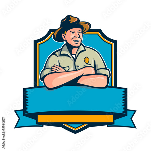 Retro style illustration of a ranger, park ranger, park warden or forest ranger with arms crossed set inside shield badge or crest on isolated background done in full color.
