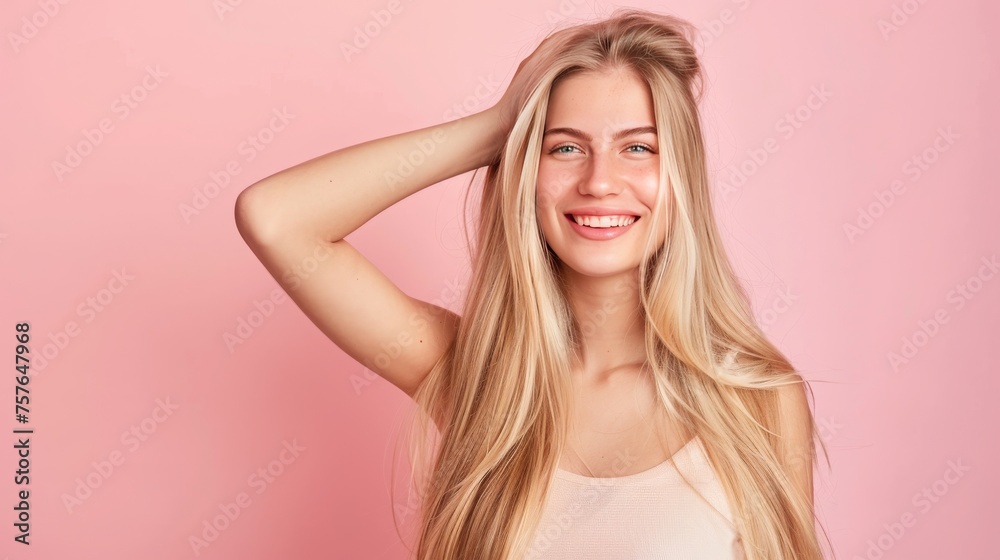 Smiling young woman with blonde long groomed hair isolated on pastel flat background with copy or text space, 16:9 Smiling young woman with blonde long groomed hair isolated on pastel flat background with copy or text space, 16:9