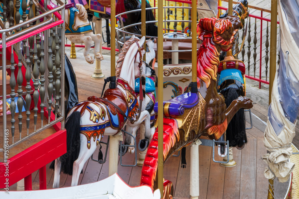 a colorful Merry Go Round with horses at Fisherman's Wharf on Pier 39 in San Francisco California USA