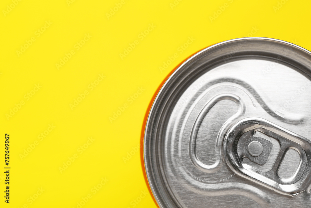 Energy drink in can on yellow background, top view. Space for text Energy drink in can on yellow background, top view. Space for text