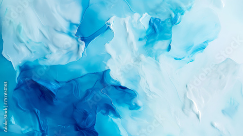 Abstract background of vivid blue and white color mixing with different tints creating uneven surface.