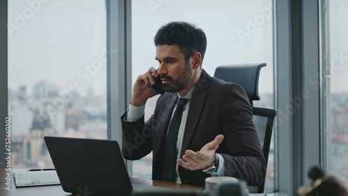 Ceo arguing phone call sitting office feeling despair closeup. Man yelling phone