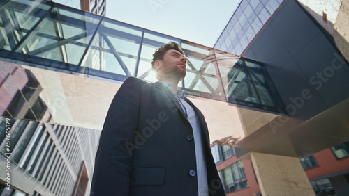 Wallpaper Mural Business owner standing street under sunlight. Young leader posing near office  Torontodigital.ca