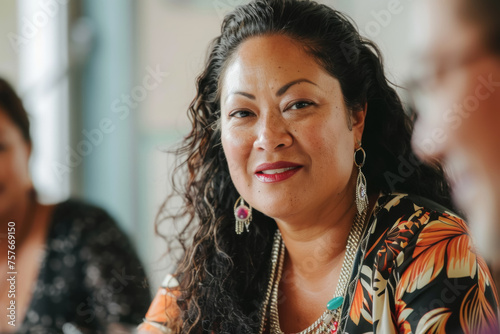Joyful Polynesian woman with a bright smile engaging in a lively conversation at a social event