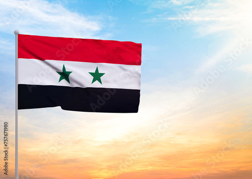 3D illustration of a Syria flag extended on a flagpole and in the background a beautiful sky with a sunset