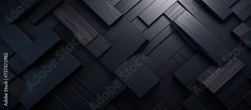 A geometric pattern of black squares on a dark background resembling the tread of automotive tires on asphalt road surfaces. The monochromatic design features shades of grey and wood flooring