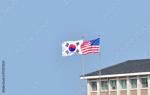 Flying the American flag and South Korean Flag, Star-Spangled Banner and Taegeukgi