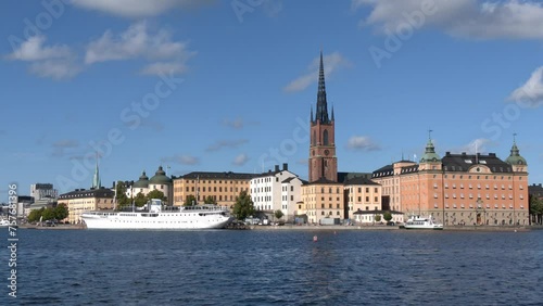 Stockholm old town general view including some ships,  the harbour and the Riddarholmen Church tower. Gamla stan. photo