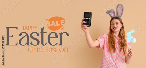 Young woman in bunny ears w...