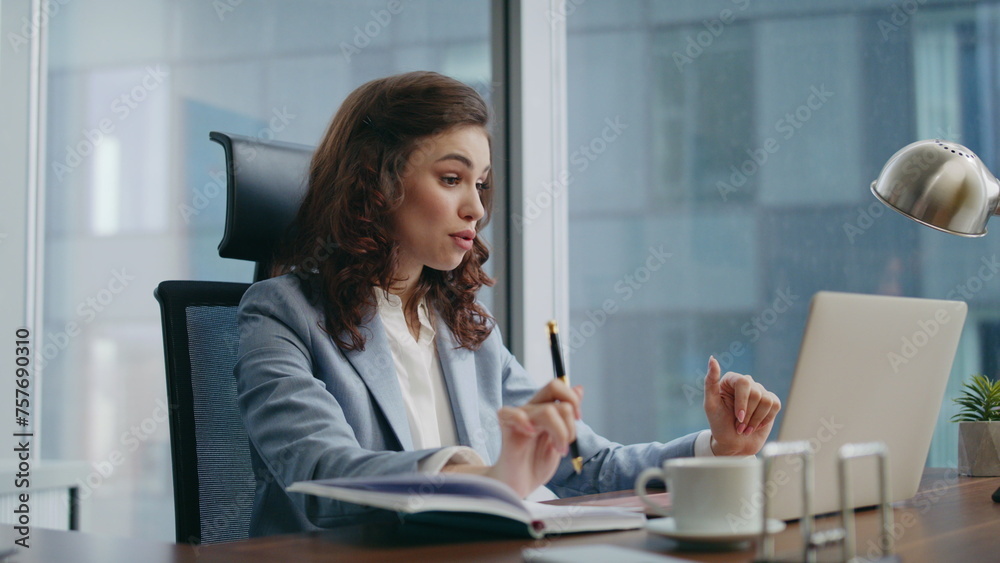 Happy employee talking laptop camera having video conference sitting office. Happy employee talking laptop camera having video conference sitting office.