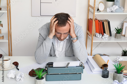 Tired mature man with scrol...
