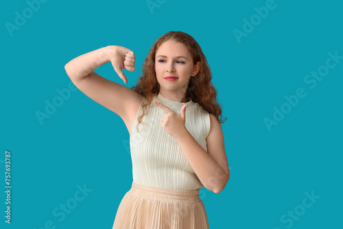 Young woman showing dislike...
