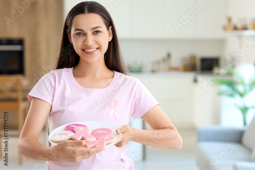 Young woman with cookies at...