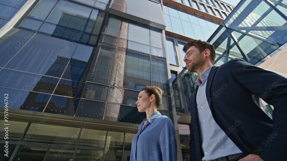 custom made wallpaper toronto digitalTwo corporate workers standing urban street looking at distance bottom view.