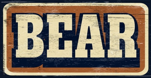 Aged and worn bear sign on wood