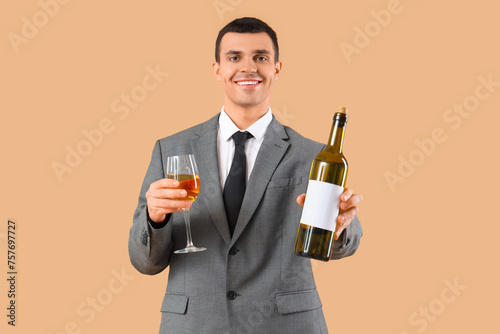 Young sommelier with glass ...
