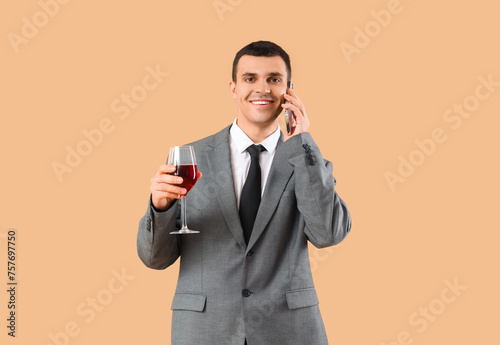 Young businessman with glas...