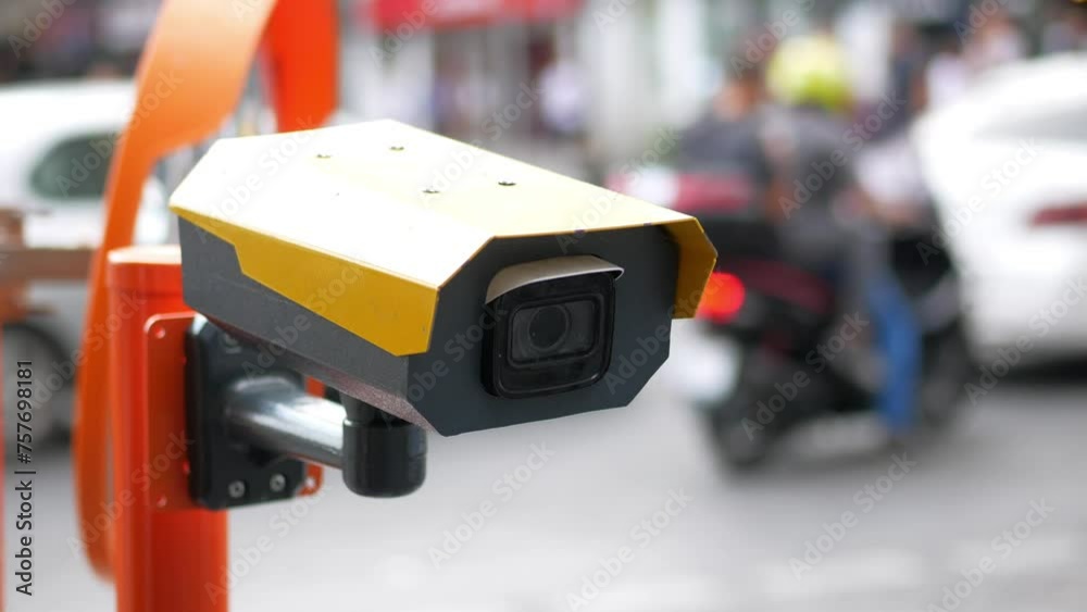 Urban security camera placements near vehicles captured in video footage Urban security camera placements near vehicles captured in video footage