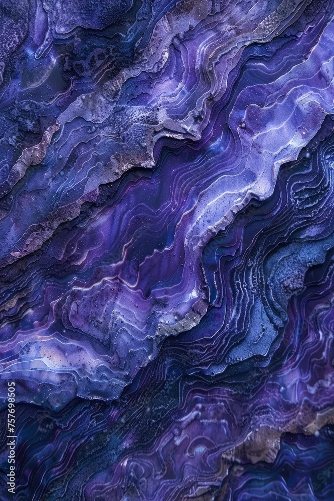 Obraz premium A wallpaper featuring a beautiful blend of purple and blue marbled patterns, creating a striking and elegant visual display