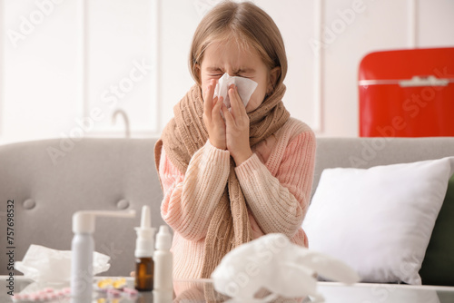Sick little girl with tissu...