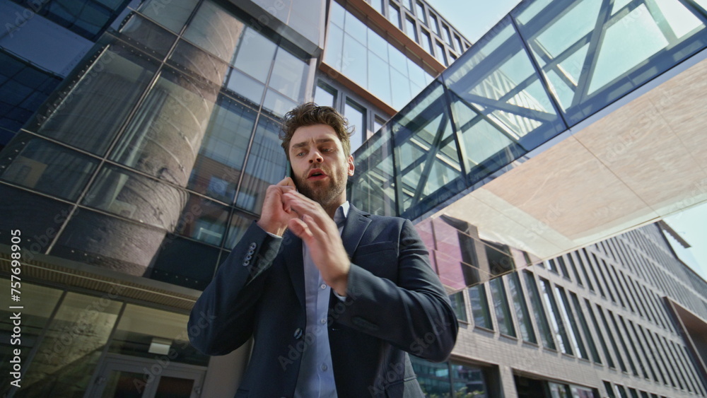 Man ceo arguing smartphone gesturing emotionally at downtown close up. Man call Man ceo arguing smartphone gesturing emotionally at downtown close up. Man call