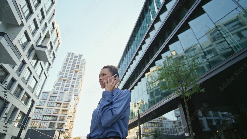 Annoyed business woman calling at modern downtown close up. Nervous woman talk Annoyed business woman calling at modern downtown close up. Nervous woman talk