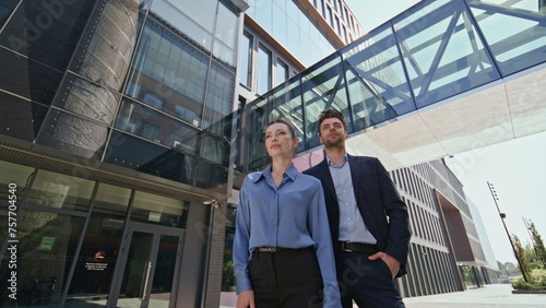 Wallpaper Mural Portrait couple office employees outside contemporary office building zoom in.  Torontodigital.ca