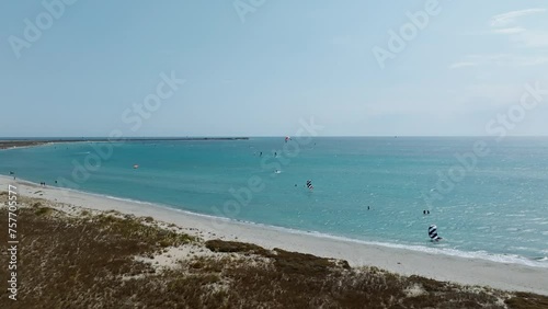 Windsurfing Sports Adventure In Keros Beach During Summer In Lemnos Island, Greece. Aerial Wide Shot photo