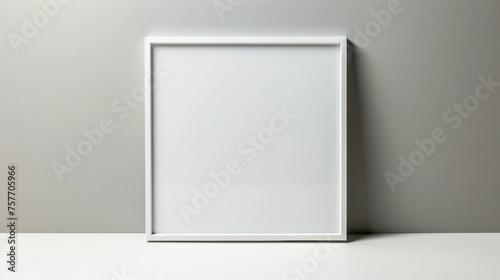 a simple white modern 8x10 frame against a plain light gray wall