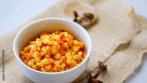Sauteed sweet corn red peppers and onions on white bowl, Indonesian cuisine.