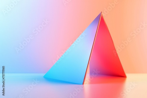 A vibrant triangle sits on a table against a pink and blue backdrop