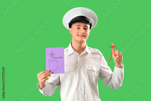 Male pilot holding paper wi...