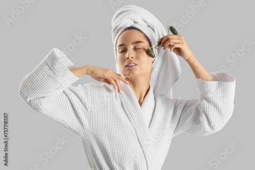 Young woman with towel mass...