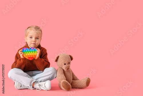 Little girl with pop it fid...