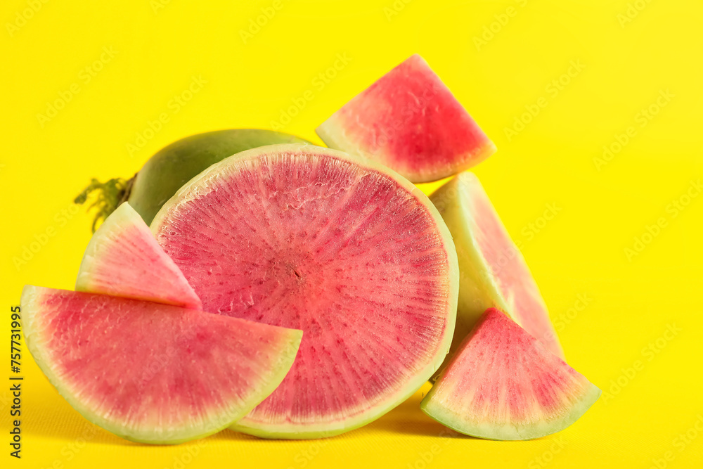 Cut fresh watermelon radish on yellow background Cut fresh watermelon radish on yellow background