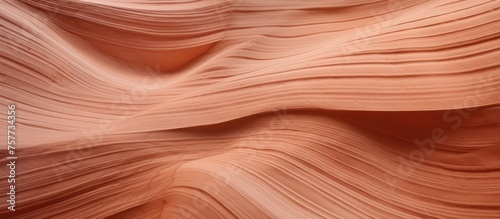 A close up of a sand dune in the desert resembles the intricate pattern of hardwood flooring stained in a warm peach color, creating a stunning landscape formation