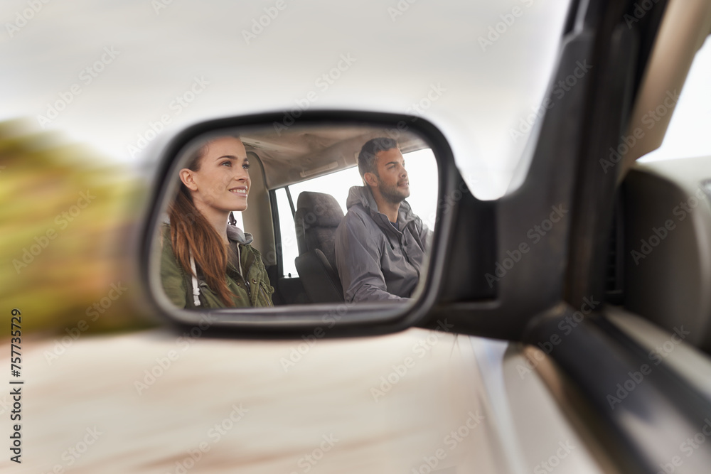Couple, car and mirror on roadtrip with travel for adventure, vacation and reflection with happiness in countryside. Woman, man and driving in transport for holiday journey, tourism or honeymoon trip