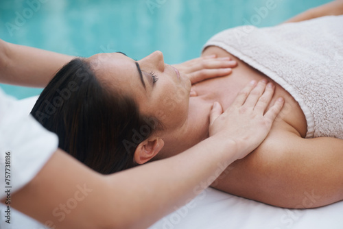 Hands  woman and masseuse at spa for massage  health and wellness for zen  therapy or peace. Female person  lady or relax for luxury  body or wellbeing on table  natural or calm near pool