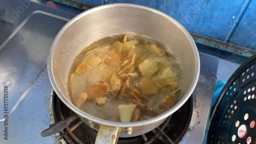 Boiling ginger in a hot pot at home kitchen. Healthy lifestyle concept