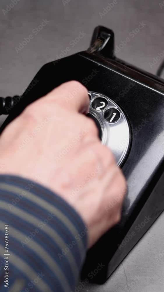 Elderly Man Dialing All Numbers On An Old Vintage Rotary Style Telephone. Vertical Elderly Man Dialing All Numbers On An Old Vintage Rotary Style Telephone. Vertical