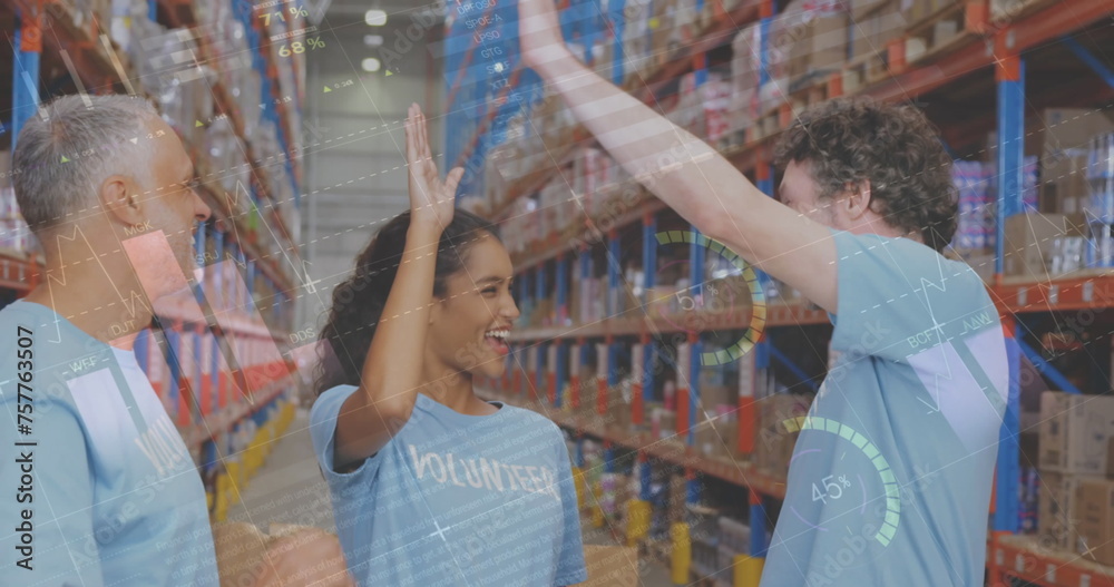 Obraz premium Image of statistics and data processing over smiling volunteers working in warehouse