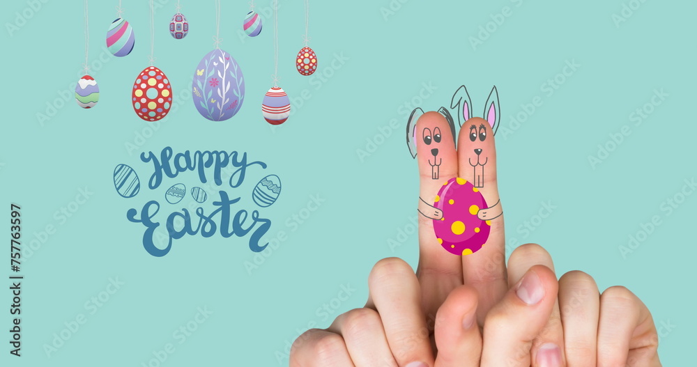 Obraz premium Image of happy easter, eggs and fingers paint as bunnies on mint background