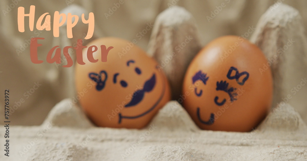 Obraz premium Image of happy easter over eggs with faces in egg cardboard
