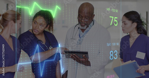 Image of cardiograph over diverse doctors working at hospital