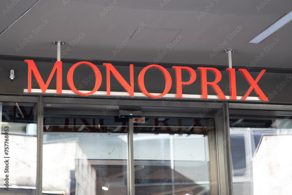 Monoprix logo brand and red sign text on wall entrance city shop ...