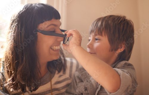 Remove glasses  mother and son with smile  funny and family with happiness and cheerful in a lounge. Single parent  mama and kid with childhood and take off eyewear with joy and humor with laughing
