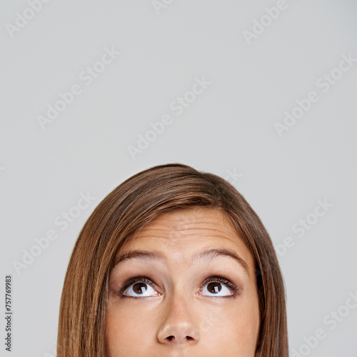 Studio, head and closeup with eyes, thinking and mockup for idea or vision. Woman, planning and memory with optimism, positive and hopeful for future contemplating isolated on white background
