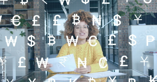 White currency symbols scrolling over happy biracial casual businesswoman having image call